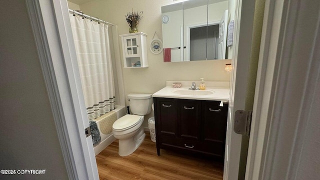 17225 Kimeluk St, Ninilchik, AK 99639 - full bathroom featuring vanity, wood finished floors, shower / bath combination with curtain, and toilet