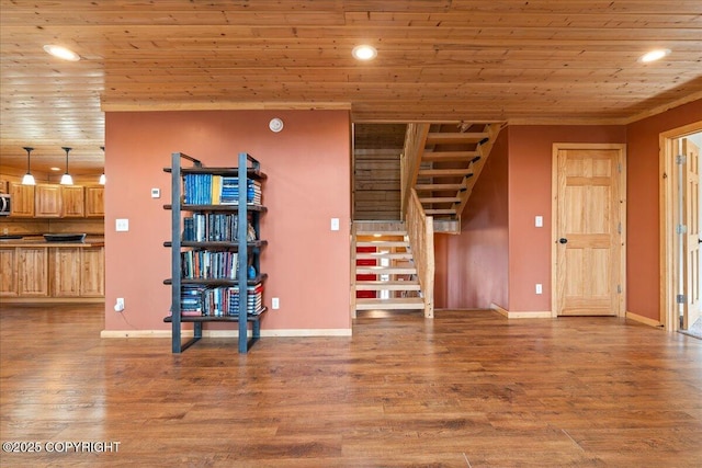 unfurnished living room featuring recessed lighting, baseboards, wood finished floors, wood ceiling, and stairway