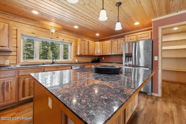 kitchen featuring stainless steel refrigerator with ice dispenser, a sink, light wood-style flooring, and wooden ceiling