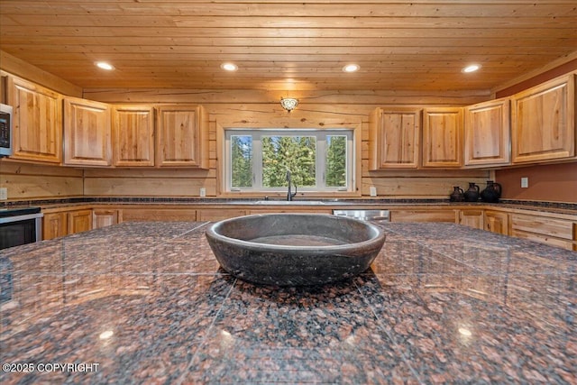 kitchen featuring recessed lighting, wooden ceiling, and a sink
