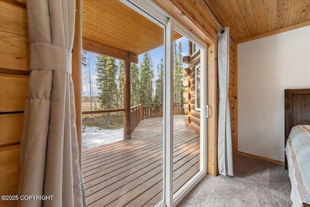 entryway featuring wooden ceiling and carpet floors