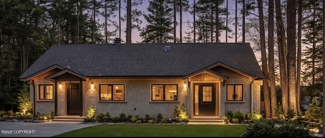 1205 N Williwaw Way, Wasilla, AK 99654 - view of front of home with board and batten siding, roof with shingles, and a yard