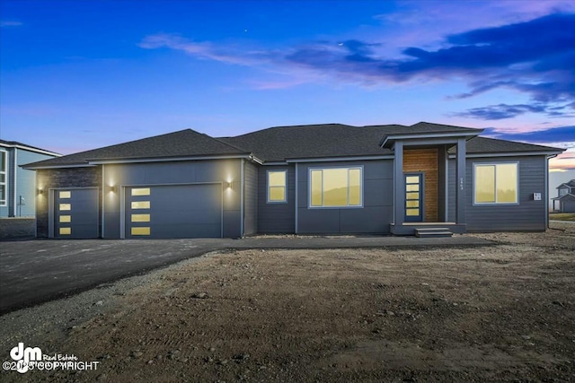 2600 S Sanctuary Dr, Wasilla, AK 99654 - view of front facade with a garage, driveway, and a shingled roof