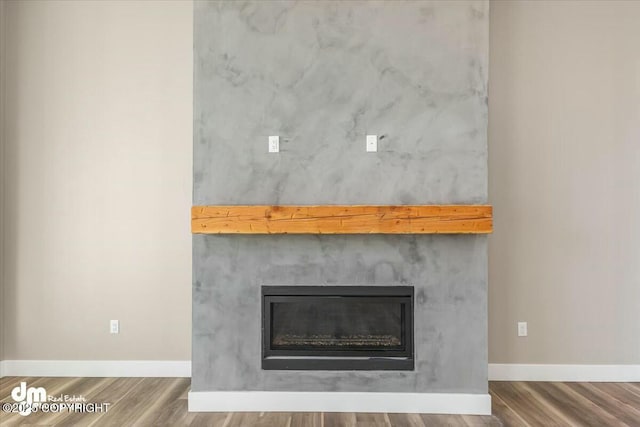 2600 S Sanctuary Dr, Wasilla, AK 99654 - detailed view of a glass covered fireplace and wood finished floors