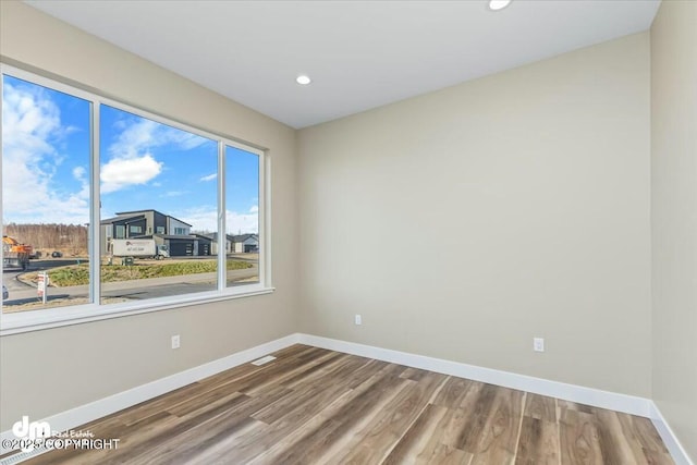 2600 S Sanctuary Dr, Wasilla, AK 99654 - empty room featuring wood finished floors and recessed lighting