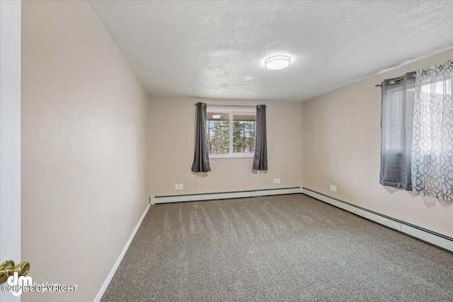 unfurnished room with baseboards, baseboard heating, carpet flooring, and a textured ceiling