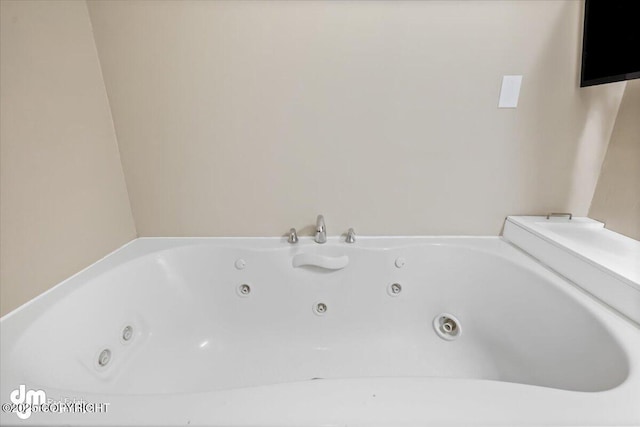 full bath with a jetted tub