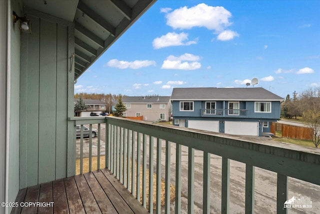 exterior space with a residential view and a garage
