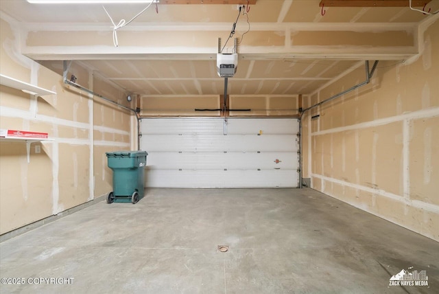 garage featuring a garage door opener