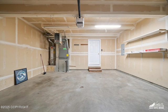 garage featuring water heater and electric panel
