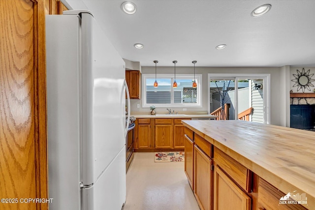 3294 Montpelier Ct # 12-E, Anchorage, AK 99503 - kitchen with freestanding refrigerator, butcher block countertops, a sink, decorative light fixtures, and recessed lighting
