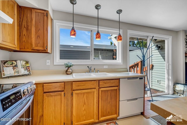 3294 Montpelier Ct # 12-E, Anchorage, AK 99503 - kitchen featuring stainless steel electric stove, a sink, dishwasher, decorative light fixtures, and light countertops