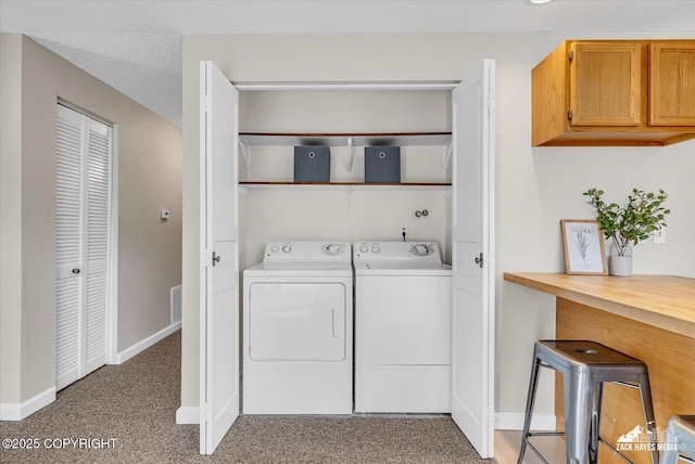 3294 Montpelier Ct # 12-E, Anchorage, AK 99503 - laundry area featuring washer and dryer, light carpet, and baseboards