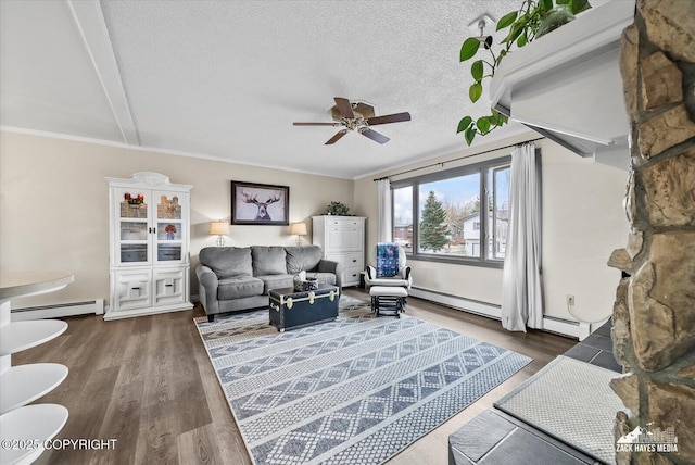 living area with a textured ceiling, a baseboard radiator, ceiling fan, and wood finished floors