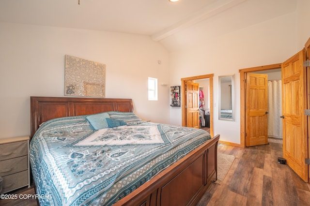 bedroom with wood finished floors, a spacious closet, beamed ceiling, high vaulted ceiling, and a closet