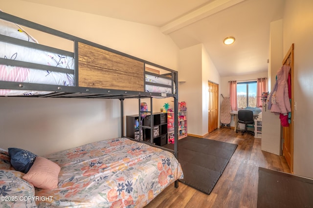 bedroom featuring wood finished floors and a desk