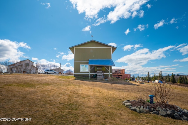 back of house with a yard