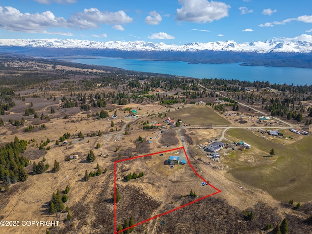view of property location featuring property parcel outlined and a water and mountain view