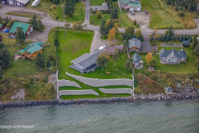 bird's eye view featuring a water view and a residential view