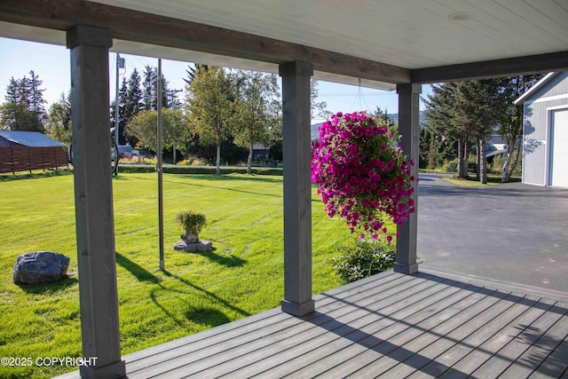 wooden deck with a yard