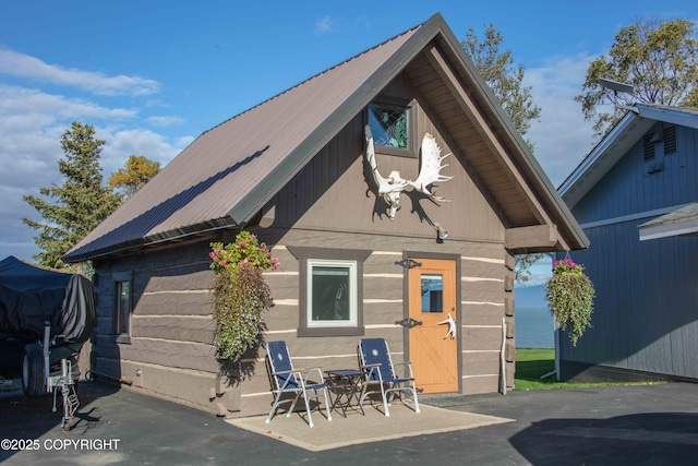 exterior space featuring metal roof