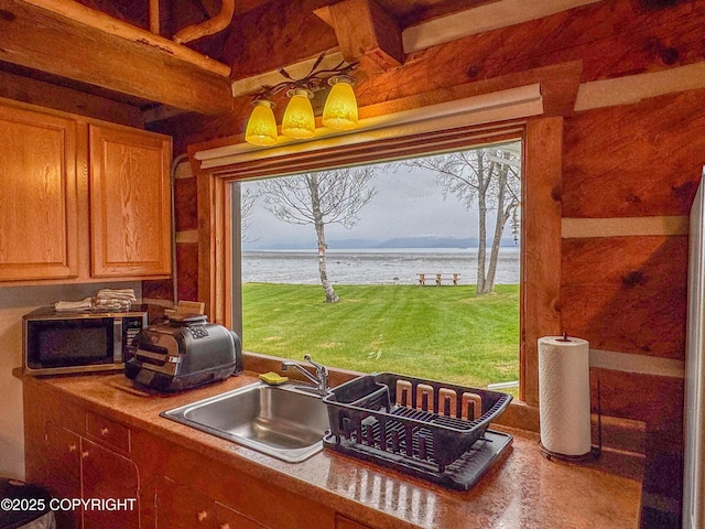 kitchen with a sink and a water view