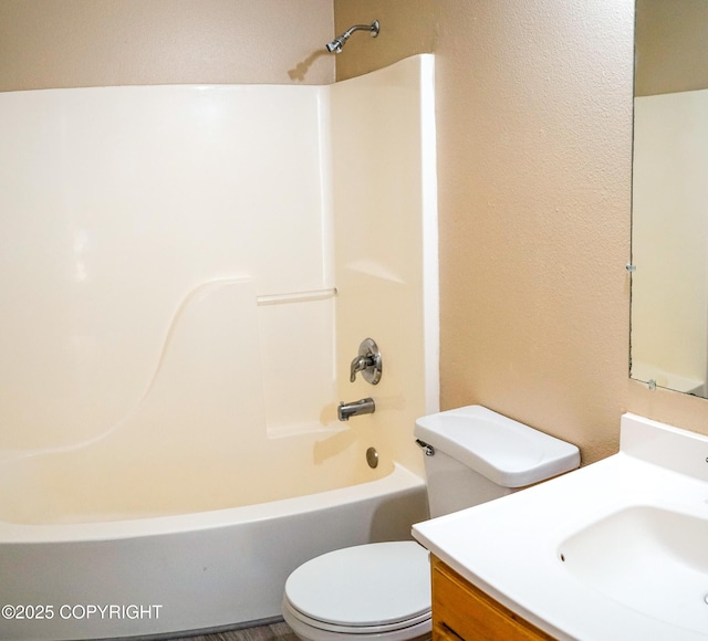 full bath with shower / bathing tub combination, vanity, and toilet