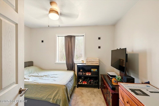 bedroom featuring ceiling fan and light colored carpet