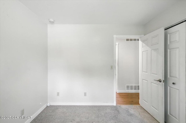 6132 S Northern Lights St, Wasilla, AK 99623 - unfurnished bedroom featuring light carpet