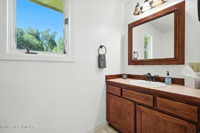 6132 S Northern Lights St, Wasilla, AK 99623 - bathroom with vanity and baseboards