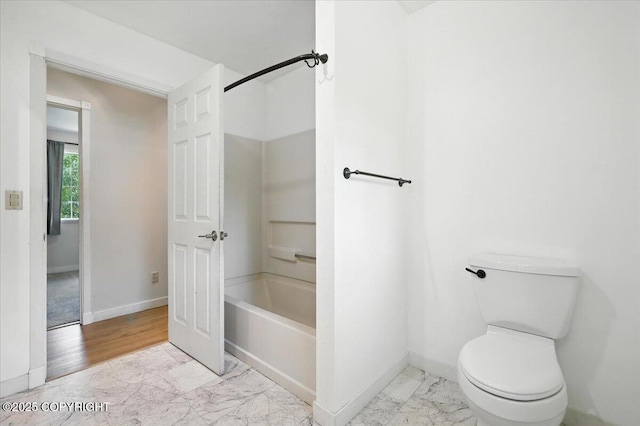 6132 S Northern Lights St, Wasilla, AK 99623 - bathroom with marble look tiles and toilet