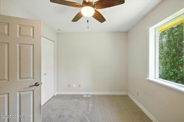 6132 S Northern Lights St, Wasilla, AK 99623 - carpeted spare room with healthy amount of natural light, a ceiling fan, and a smoke detector