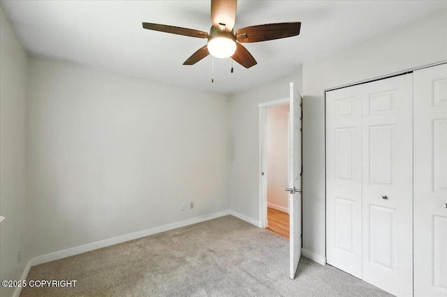 6132 S Northern Lights St, Wasilla, AK 99623 - unfurnished bedroom featuring light carpet, a closet, and a ceiling fan
