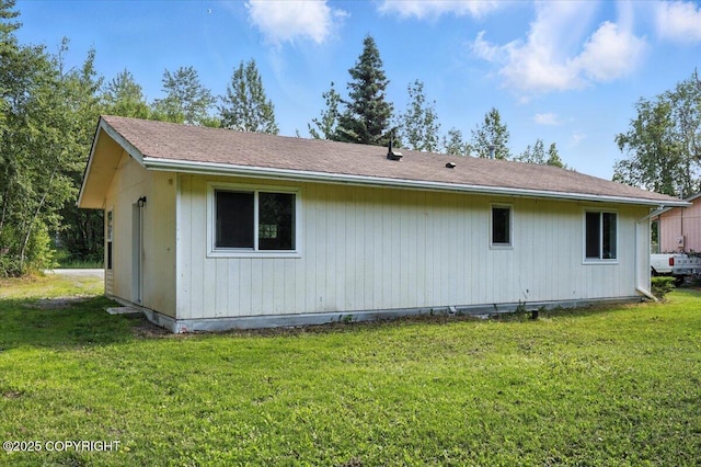 6132 S Northern Lights St, Wasilla, AK 99623 - back of property with a lawn