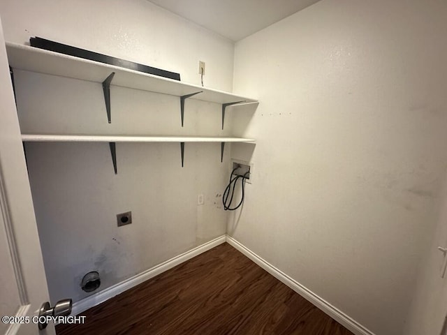 clothes washing area featuring laundry area, dark wood-style flooring, baseboards, hookup for a washing machine, and electric dryer hookup