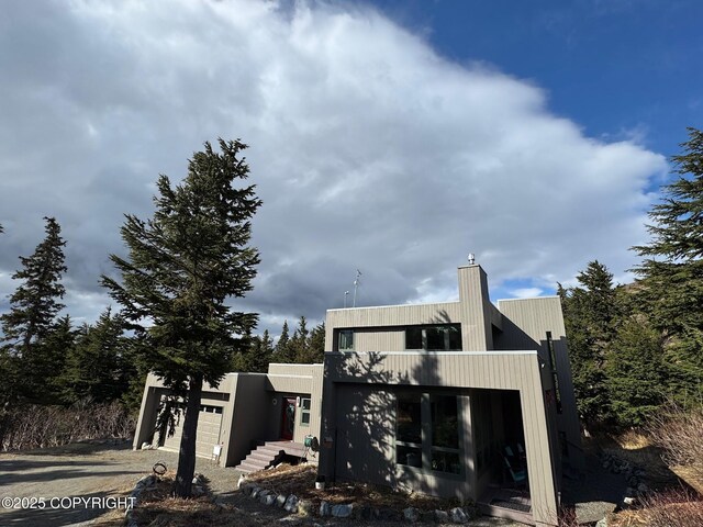 7041 Potter Hts, Anchorage, AK 99516 - exterior space with a chimney