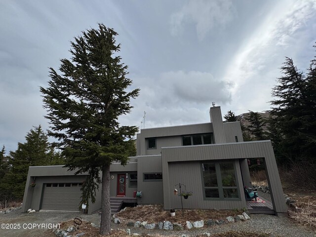 7041 Potter Hts, Anchorage, AK 99516 - modern home featuring an attached garage and a chimney