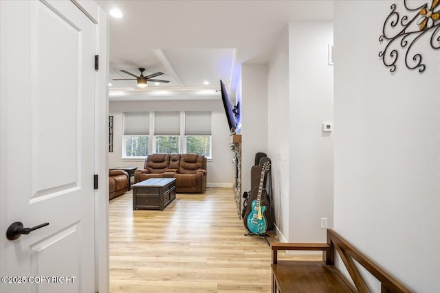 living area with light wood-style floors, baseboards, recessed lighting, a ceiling fan, and coffered ceiling