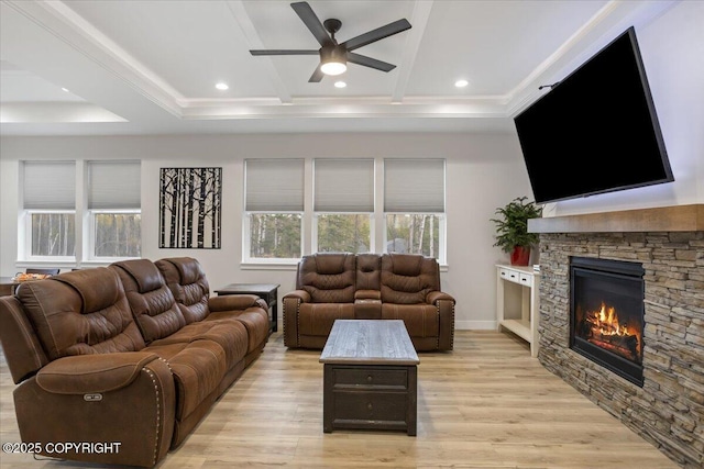 living room featuring a fireplace, light wood-type flooring, recessed lighting, a ceiling fan, and coffered ceiling