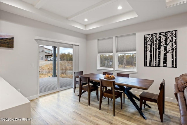 dining room with baseboards, beam ceiling, recessed lighting, and light wood-style flooring