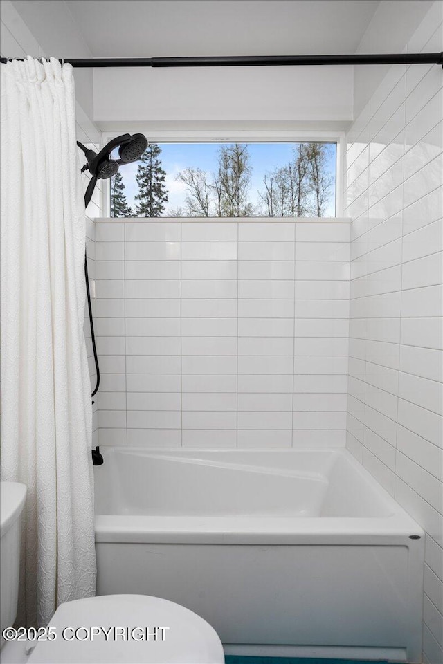 full bathroom with shower / bath combo and toilet