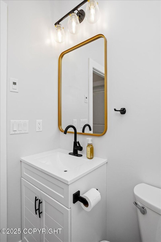 half bath with toilet and vanity