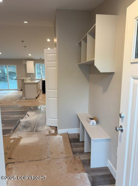 mudroom featuring recessed lighting and baseboards