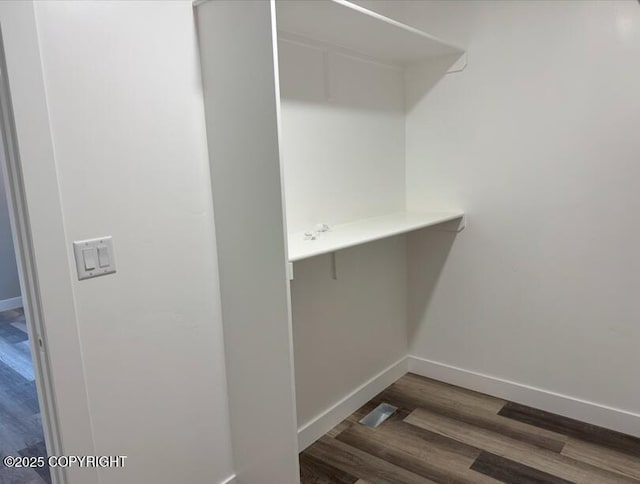 spacious closet featuring wood finished floors