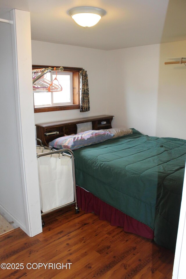 bedroom with wood finished floors