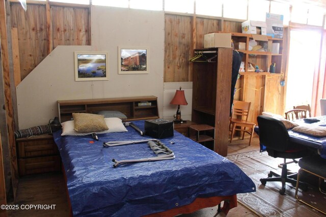 bedroom with wood finished floors