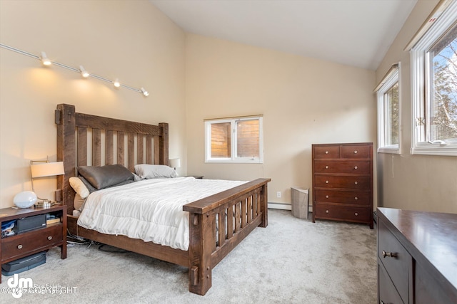 carpeted bedroom featuring a baseboard radiator and high vaulted ceiling