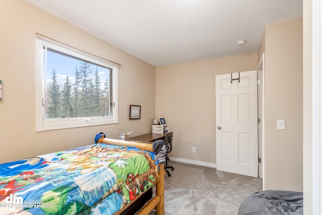 carpeted bedroom with baseboards