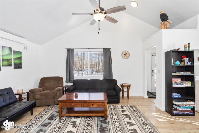 living area with visible vents, light wood-style floors, baseboards, high vaulted ceiling, and a ceiling fan