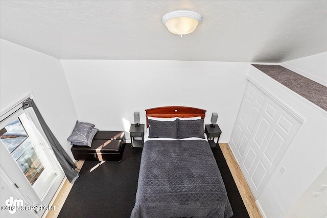 bedroom with light wood-style floors and baseboards